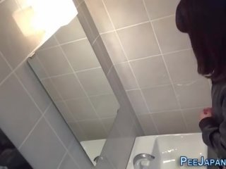 Asia babes filmed peeing